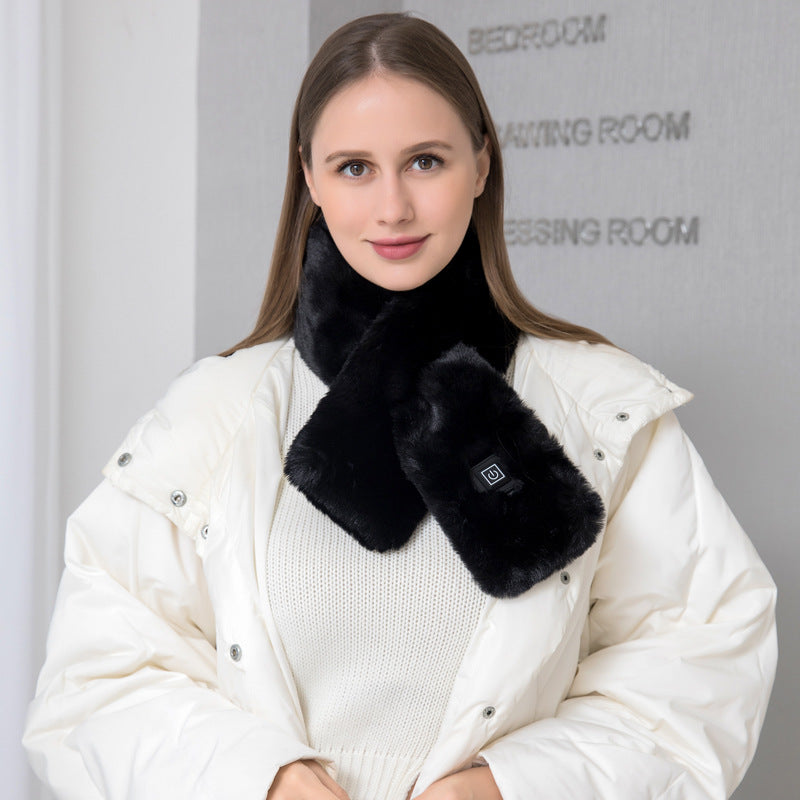 Woman wearing the black faux fur USB heated scarf over a white winter jacket