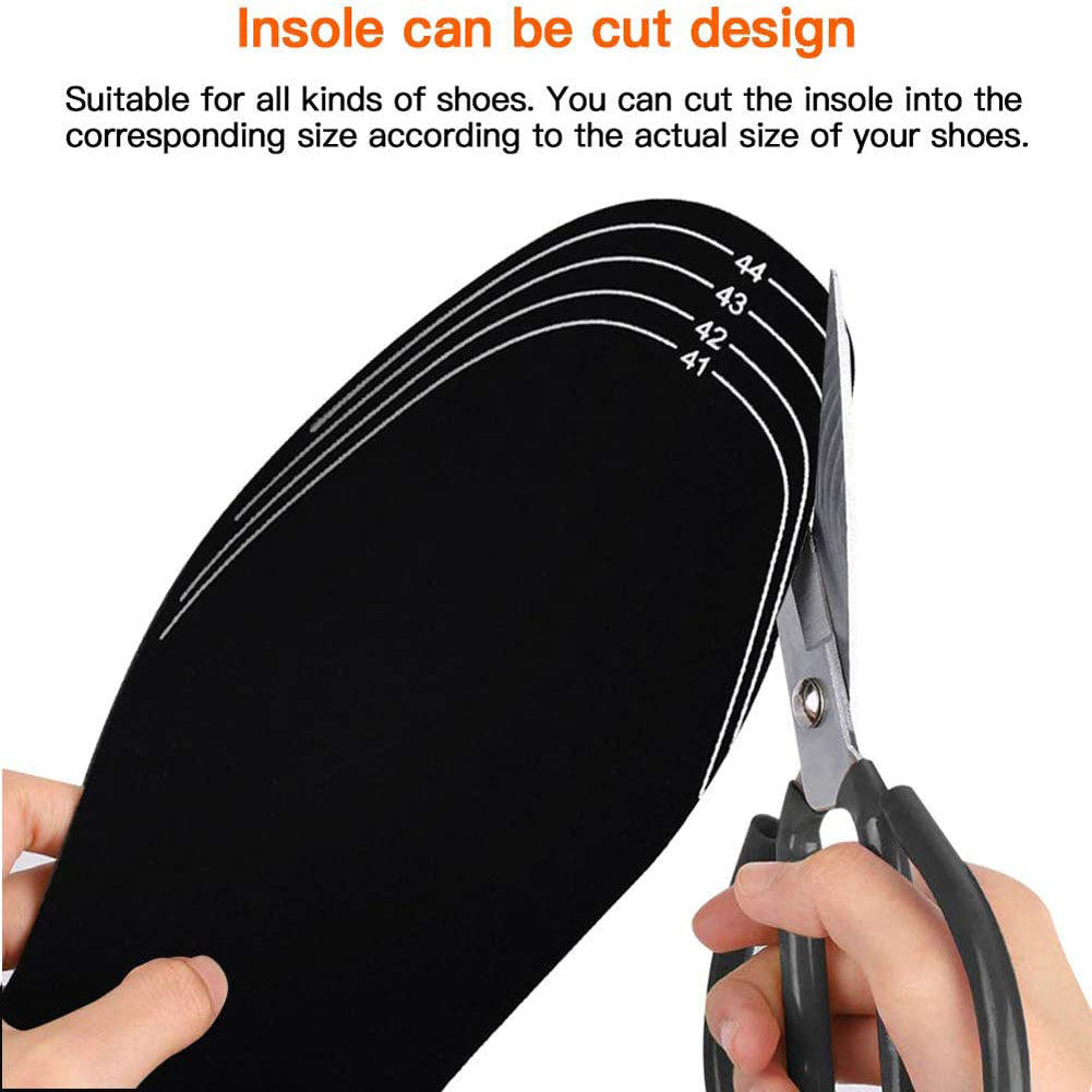 Trimming a heated insole with scissors along the printed size guide lines