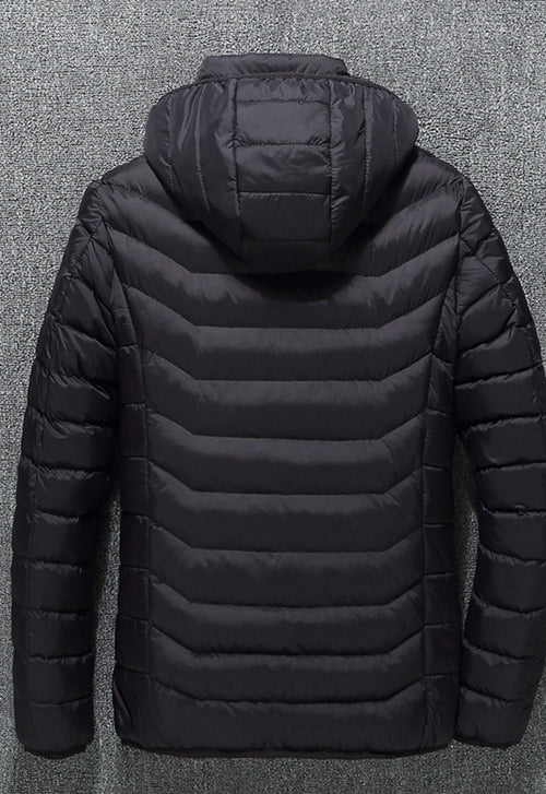 NorthCinch USB heated hooded puffer jacket in black, back view with the hood up