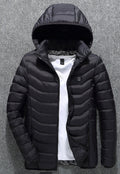 NorthCinch USB heated hooded puffer jacket in black, front view with the chest power button