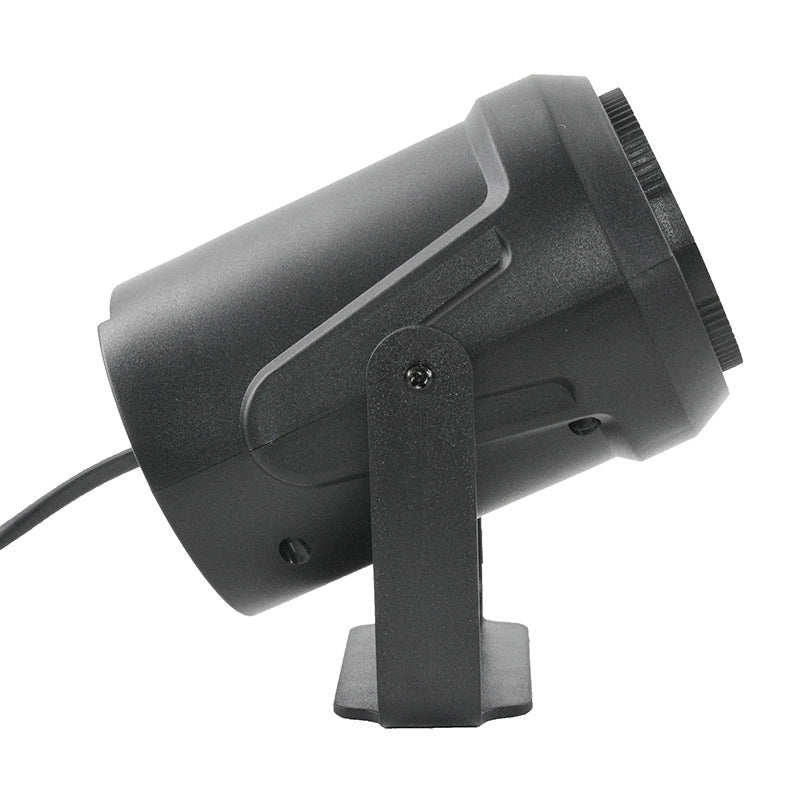Side view of the black snowflake projector on its tilting bracket